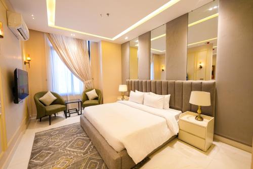 a hotel room with a bed and a television at Pavilion Suites - Premium ApartHotel in Bahria Town in Rawalpindi