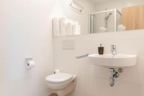 Koupelna v ubytování Das Falk Apartmenthaus