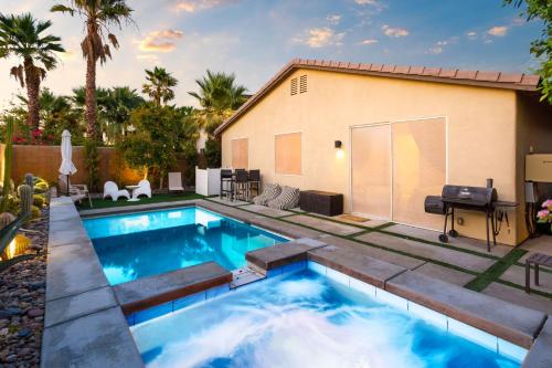 a swimming pool in a backyard with a house at Walk to the Festivals - Private Pool & Spa in Indio
