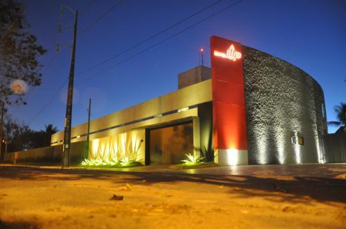 a building with a sign on the side of it at Motel UP (Adult Only) in Fortaleza
