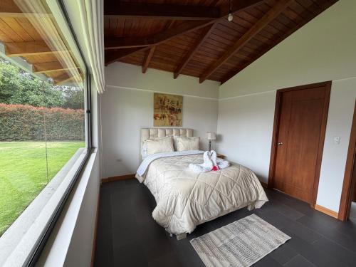 Postel nebo postele na pokoji v ubytování Quinta María Mercedes