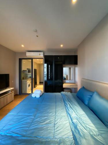 Giường trong phòng chung tại Once芭提雅Luxury Condo is near Terminal 21