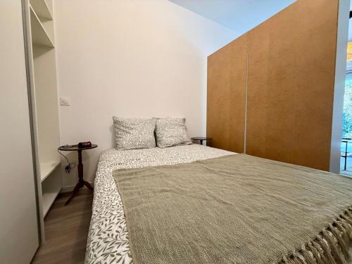 En eller flere senge i et værelse på Appartement Cosy Bord de Lac