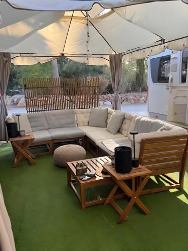 a living room with a couch and tables under a tent at The Retreat - Armacao de Pera, Algarve Portugal in Pêra