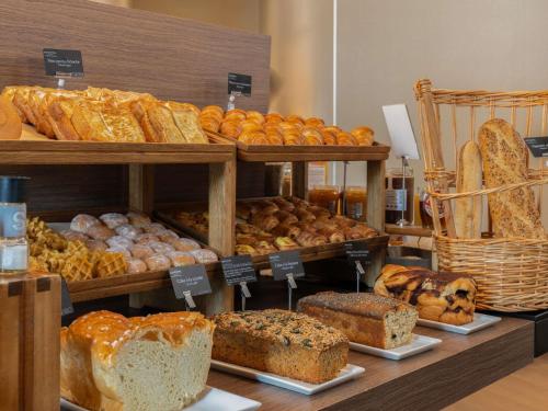 a bakery with lots of different types of bread at Novotel Suites Paris Expo Porte de Versailles in Paris