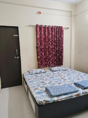 Postel nebo postele na pokoji v ubytování Durga Bhakt Niwas