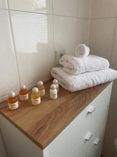 a bathroom with towels on a wooden counter at Your home away from home in Osnabrück