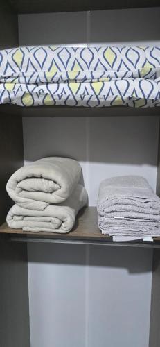 two towels sitting on a shelf with a mattress at Villa Serena in Nova Odessa