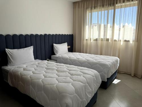 Ένα ή περισσότερα κρεβάτια σε δωμάτιο στο New Comfortable Apartment with Netflix & IPTV