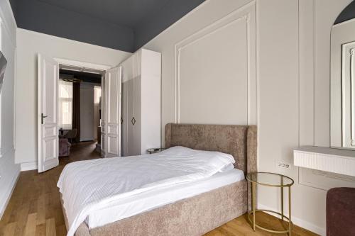 Ένα ή περισσότερα κρεβάτια σε δωμάτιο στο Bulevard Suite