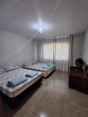 Katil atau katil-katil dalam bilik di Casa Ferreira Localizada a 400 metros da Basílica