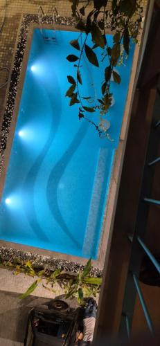 a person standing next to a swimming pool at Brizo Paradiso in Matara