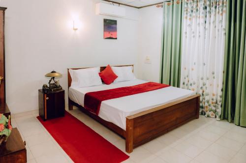 Giường trong phòng chung tại Ocean Glow