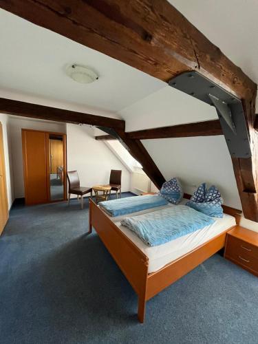 a bedroom with a bed in a room at Hotel Iris- Pizzeria Ristorante La Taverna in Meersburg