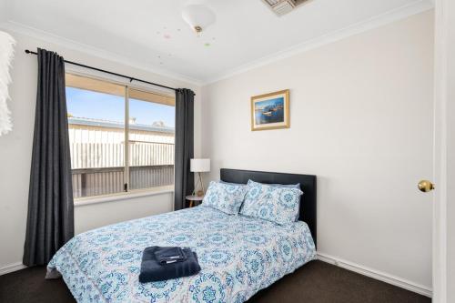 Postel nebo postele na pokoji v ubytování Happy on Hawkins