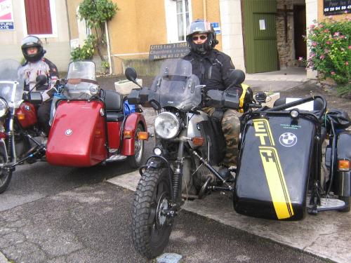 a man sitting on a motorcycle with a side car at Logîte Touristique Les 3 Loups in Châtenois