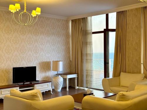 TV a/nebo společenská místnost v ubytování Retro Hotel