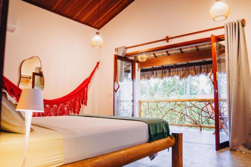 Ένα ή περισσότερα κρεβάτια σε δωμάτιο στο Casa de Coco Icarai