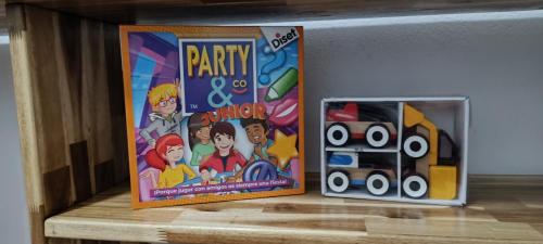 a party game and a toy box on a shelf at El Mirador del Asno in El Bosque