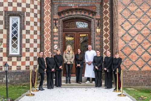a group of people standing in front of a building at Verneuil la douce in Verneuil d’Avre et d’Iton