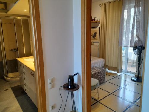 a bathroom with a sink and a toilet in a room at Rethymno Blue in Rethymno