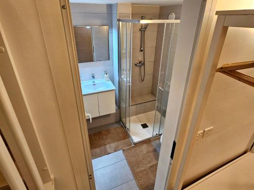 a bathroom with a shower and a sink at Casuccia Theatre Apartment by Doors Valletta in Valletta