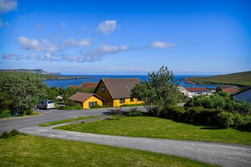 a house on the side of a road at Hillside Park Studio in Easter Quarff