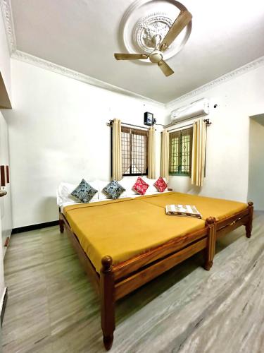 a bedroom with a large bed in a room at KPS homestay in Pondicherry