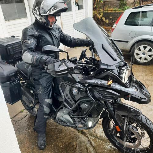a man is sitting on a motorcycle at AGAPE in Leskovac