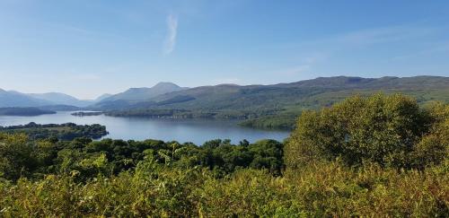 a view of a river with mountains in the background at Anchorage Accommodation in Balloch