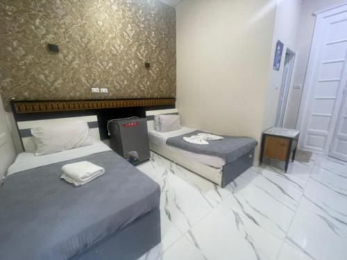 Ένα ή περισσότερα κρεβάτια σε δωμάτιο στο Cairo Season Hotel