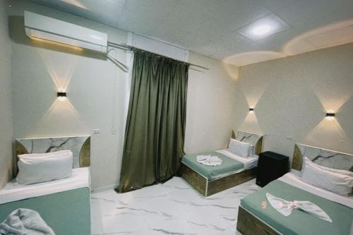 Ένα ή περισσότερα κρεβάτια σε δωμάτιο στο Cairo Season Hotel