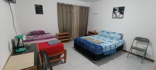 Postel nebo postele na pokoji v ubytování La Bellota Surf House Huanchaco