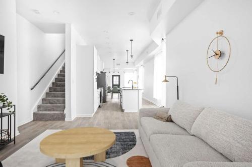 a living room with a couch and a table at Full Duplex Retreat-Two Homes Near Eastside- Family Friendly in Indianapolis