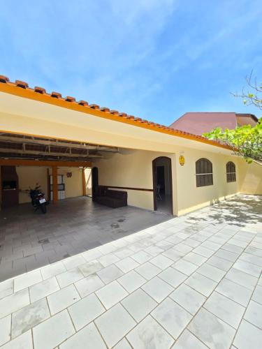 a building with a patio in front of it at Casa em Shangri-la próxima ao mar in Pontal do Paraná