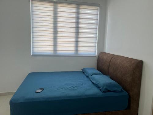 Postel nebo postele na pokoji v ubytování UmiAbah Residensi Adelia4