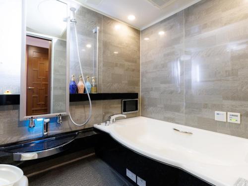 Ένα μπάνιο στο Tabist Manis RESORT VILLA