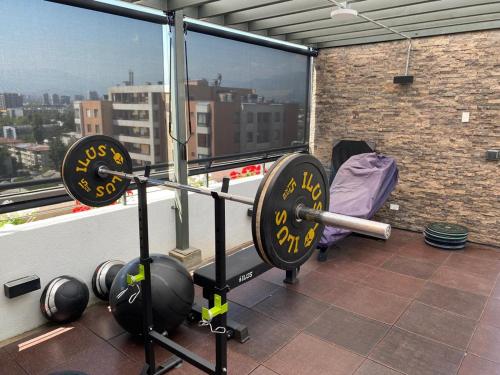 a gym with a clock on the ledge of a building at Keep walking in Nuñoa in Santiago