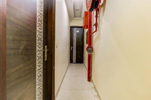 a hallway with a door to a room with a door at Hotel O La Vista in Zirakpur