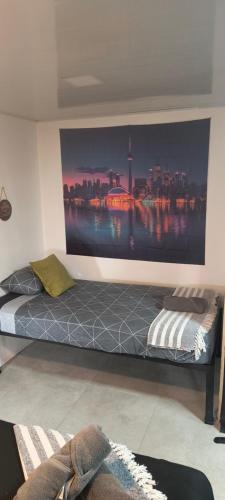 a bedroom with a large wall mural of a city at Jungle AC Suite for 3-Kitchen-Walk to Playa Chiquita -Villa Toronto in Cocles