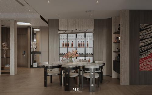 a dining room with a table and chairs at The Obsidian Sky Hanoi-Chic Loft with Rooftop Pool-Near Street Food in Hanoi