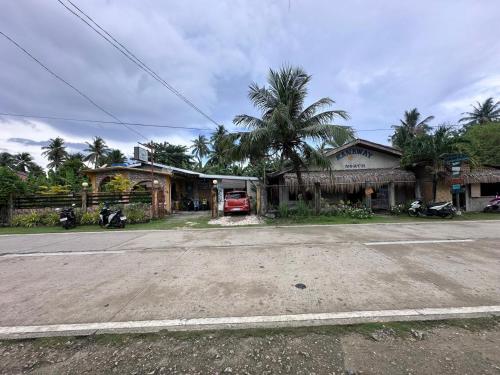 an empty street in front of a house at Subangan bayud3, Burgos central location in Burgos
