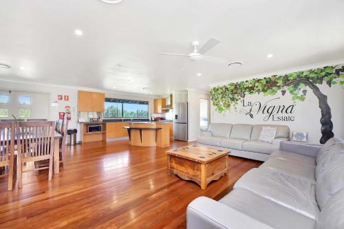 a living room with a couch and a table at Stay at Shiraz in Belford