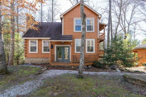 a wooden house in the middle of the woods at Hot Tub - Climber's Haven - Red River Gorge KY in Rogers
