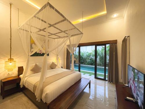 Postel nebo postele na pokoji v ubytování Villa Sinergi 2BR Tranquil Villa in Seminyak