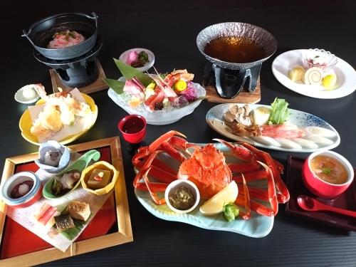 a table with several plates of food on it at Manten no Tsujinoya in Komatsu