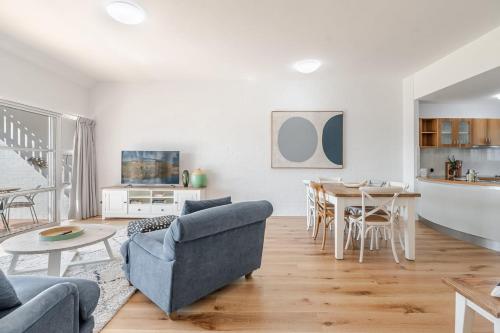 a living room with a couch and a table at Quarterdeck Unit 2 - Lennox Head in Lennox Head