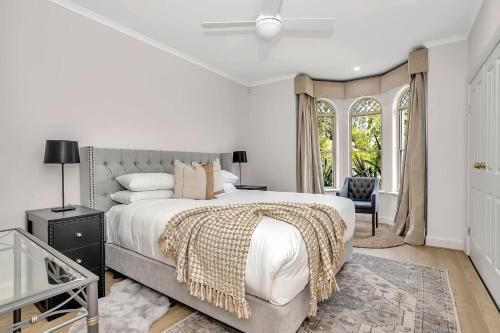 a bedroom with a large bed and a window at The Alderstone - Serene Haven in the Adelaide Hills in Aldgate