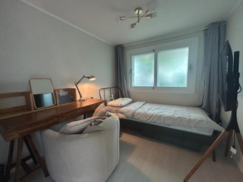 Postel nebo postele na pokoji v ubytování gam rooftop