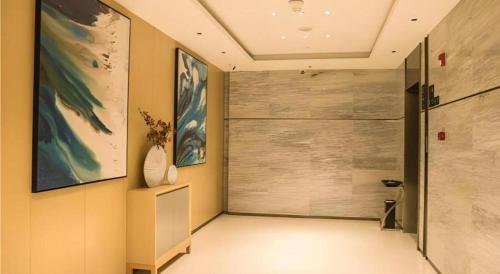 a hallway with a large sliding door in a room at City Comfort Inn Yingcheng Walking Street in Yingcheng